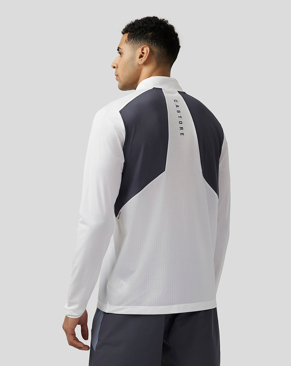 Back view of white Apex Training top with dark shoulder panels and vertical Castore branding down the spine