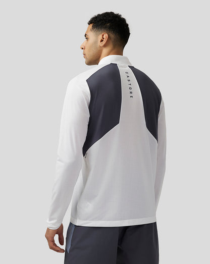 Back view of white Apex Training top with dark shoulder panels and vertical Castore branding down the spine