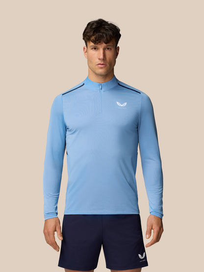 Men's Apex Training 1/4 Zip Top in sky blue worn by a model with a center front zip and small chest logo