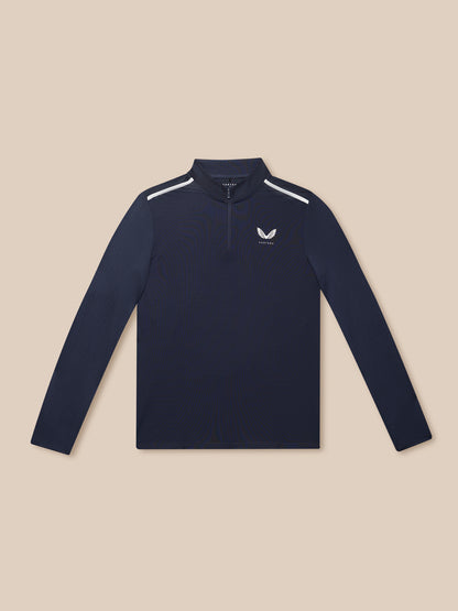 Flat lay of midnight navy Apex training top with quarter zip against a beige background.