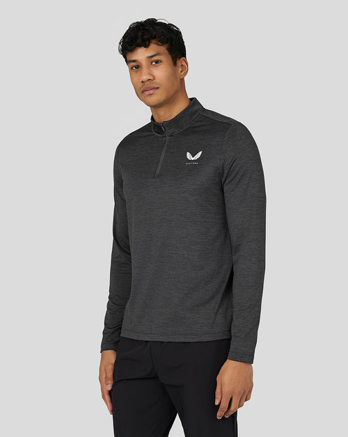 Male model wearing gunmetal Marl Quarter Zip with funnel neck and reflective hem