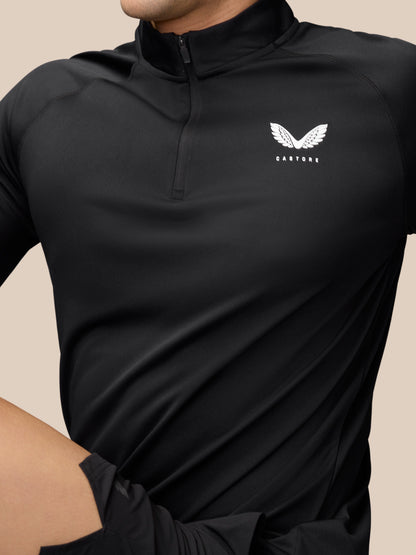 Black Adapt Training 1/4 Zip top with white Castore logo on the left chest and a short front zip