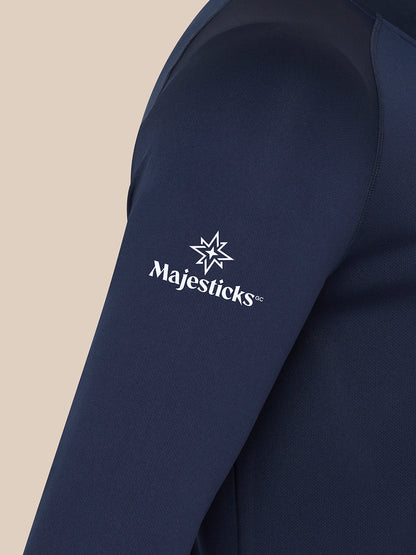Close-up of navy Majesticks golf top sleeve displaying white Majesticks star and wordmark