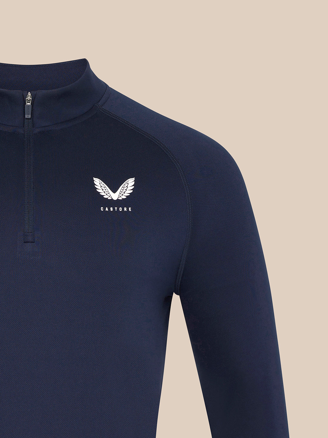 Navy quarter-zip top with zip at the neckline and white Castore wing logo on the chest