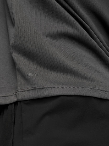 Male model wearing gunmetal Adapt Training ¼ Zip top with raglan long sleeves and quarter zip