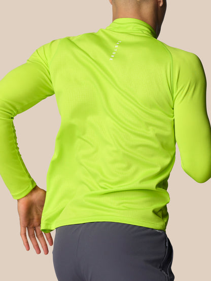 Back view of lime green Adapt Training quarter zip top with CASTORE branding on the upper back
