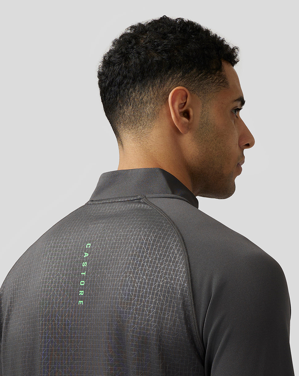Back view of men's Adapt Print gunmetal quarter zip top with geometric pattern and Castore branding on the upper back