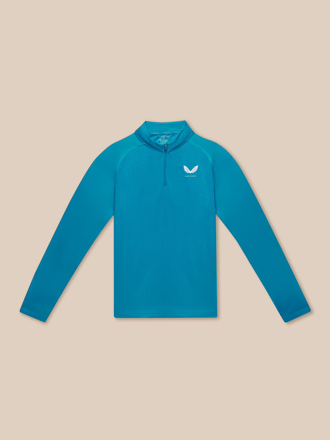 Model wearing teal Adapt Print 1/4 Zip Top with stand collar and geometric pattern