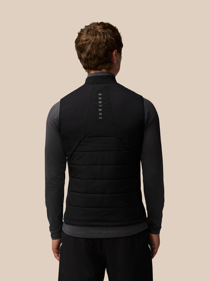 Rear view of a black sleeveless gilet with Castore branding along the back panel.