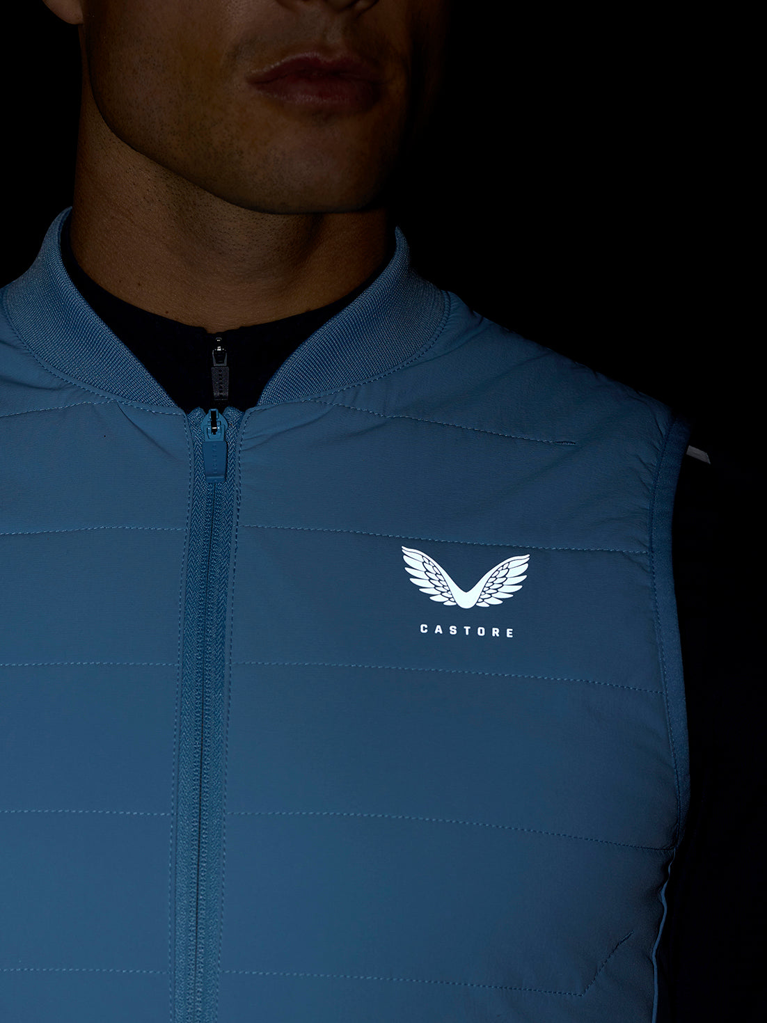 Apex Training Gilet in sky blue with zip front and Castore logo on chest