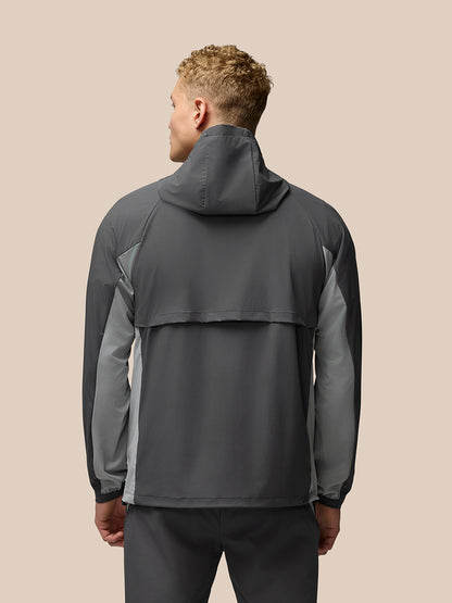 Back view of grey Flex Hooded Jacket featuring hood and contrasting panels