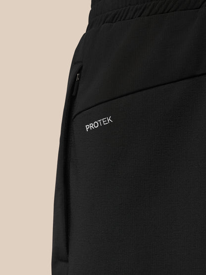 Detail of side pocket area with zipper and ProTek label on Flow Training Joggers.