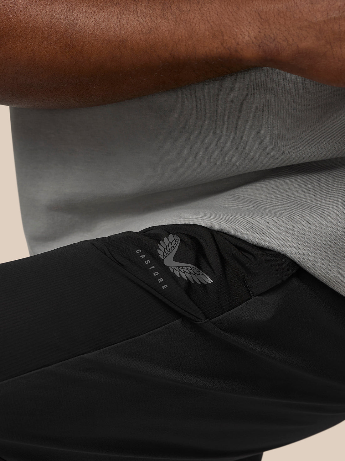 Close-up of the black Flow Training Joggers waistband with ProTek label and Castore logo.