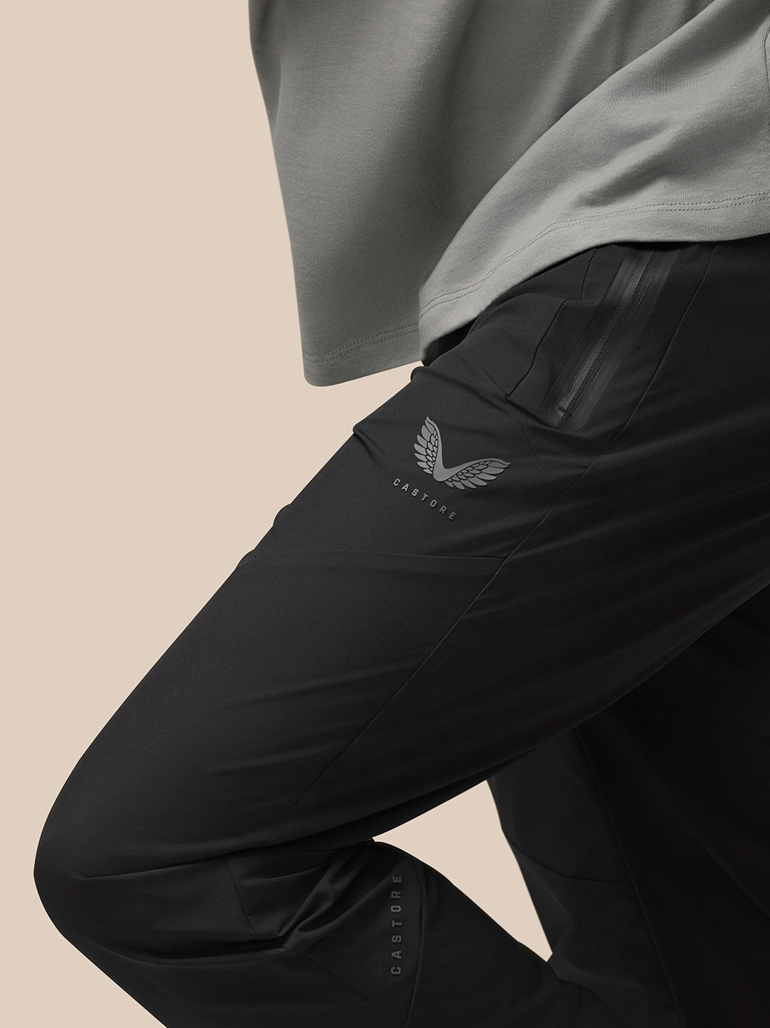 Close-up of black Flex Lightweight Joggers highlighting the Castore logo on the left thigh and a side zip pocket