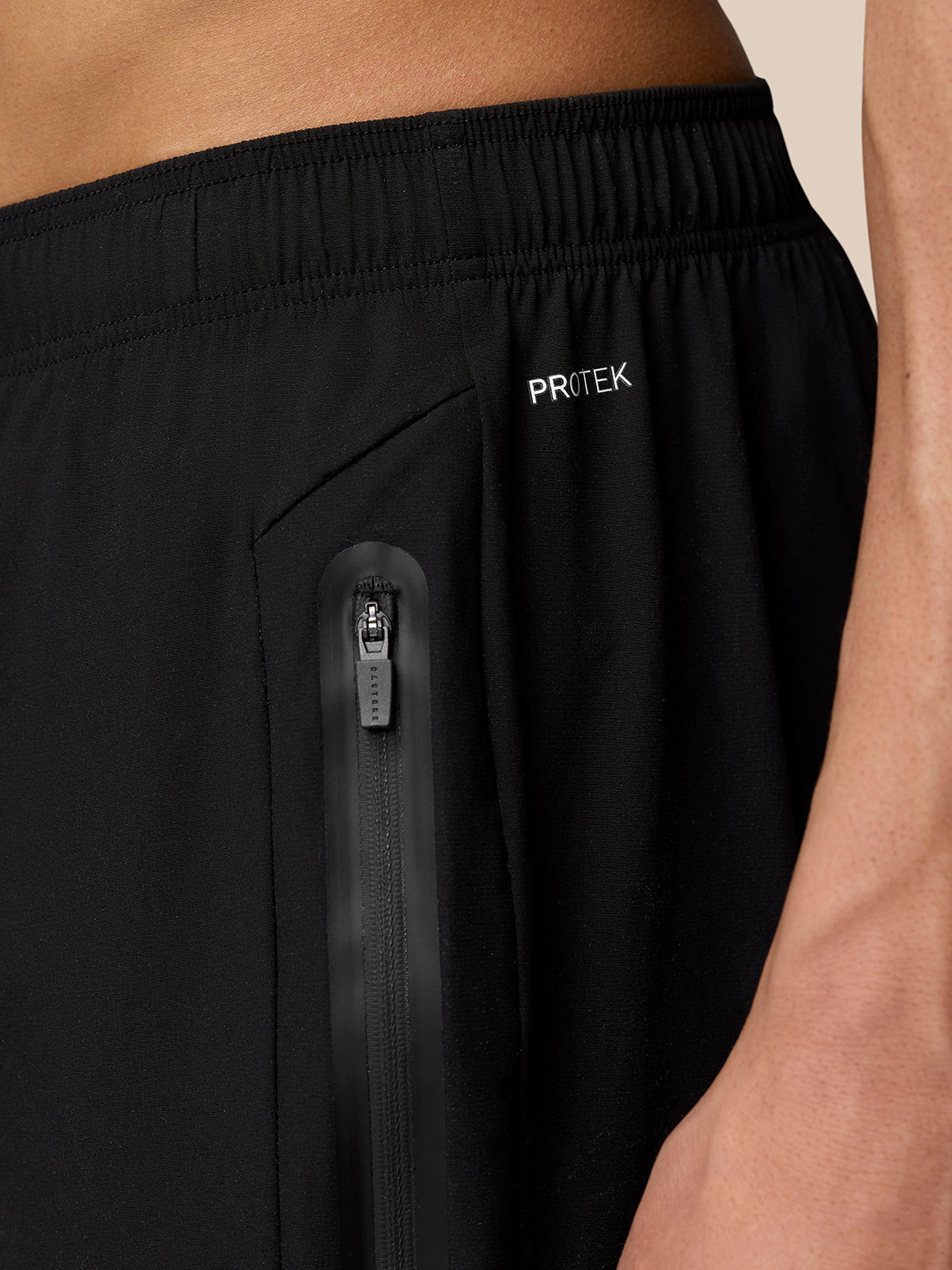 Close-up of the back waistband and zip pocket on black Flex Classic Lifestyle Joggers with ProTek branding