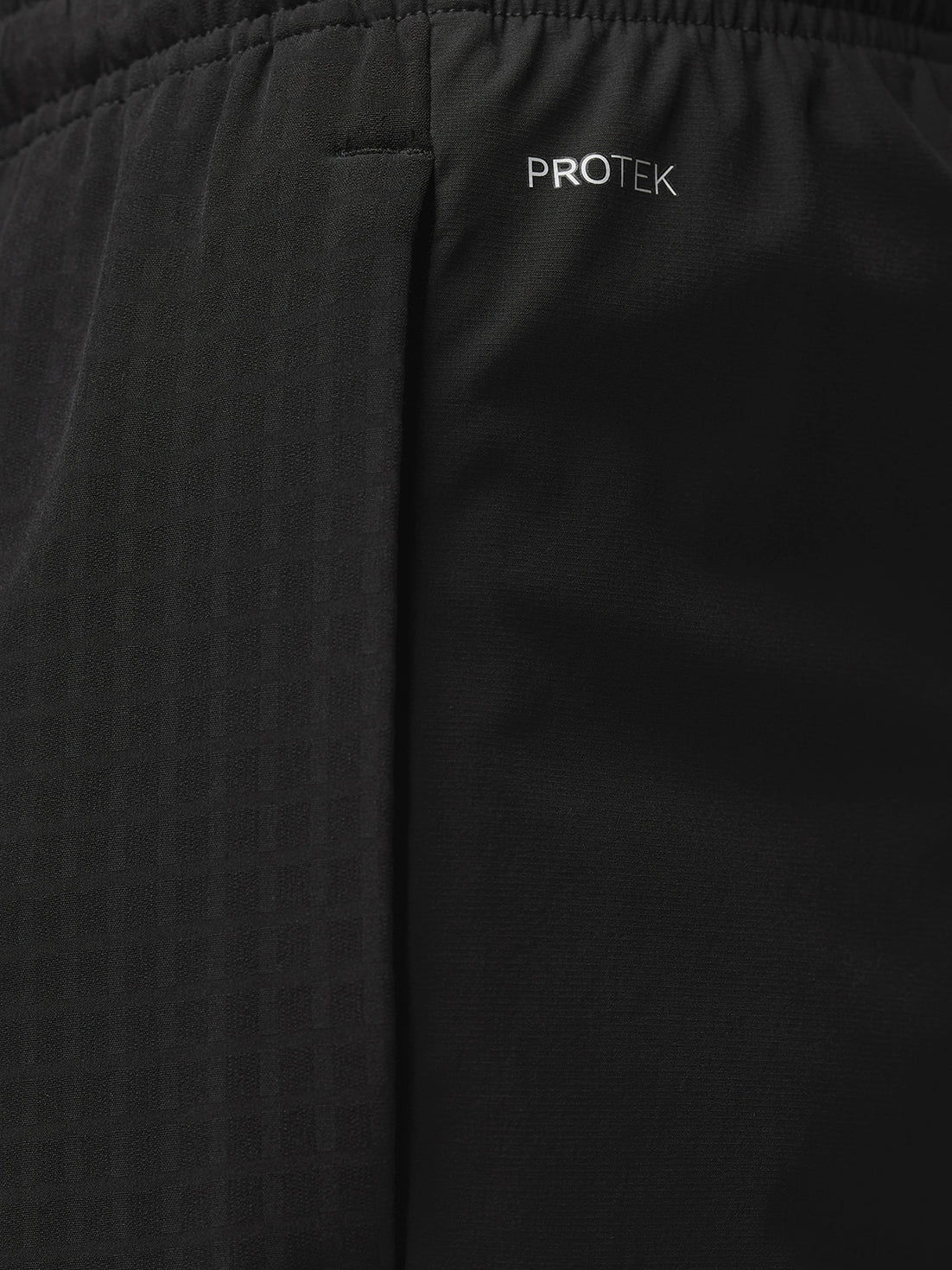 Back view of black Winterised Flex Joggers featuring Castore branding on the lower left leg.