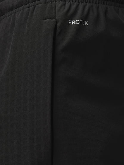Back view of black Winterised Flex Joggers featuring Castore branding on the lower left leg.