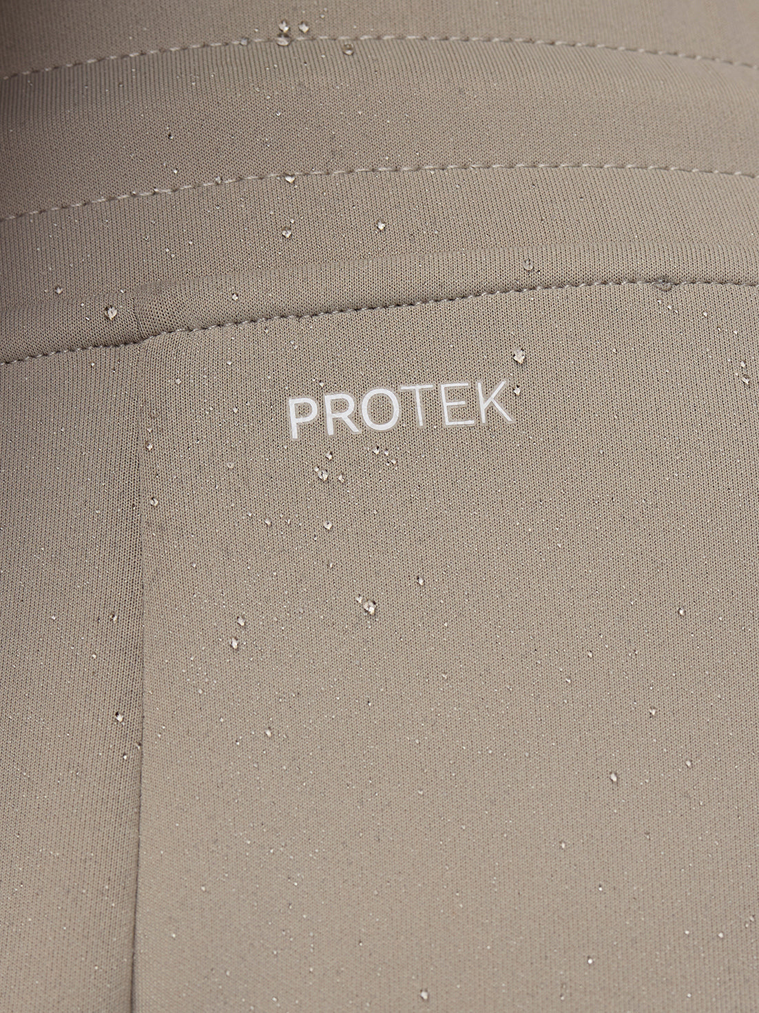 ProTek water resistant fabric close-up with droplets on Rock Grey joggers