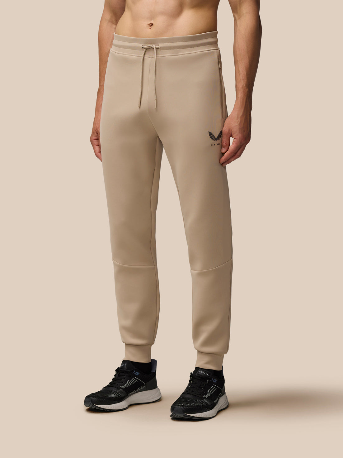 Beige Mushroom Flex Lifestyle Joggers with drawstring waist and left thigh Castore logo.