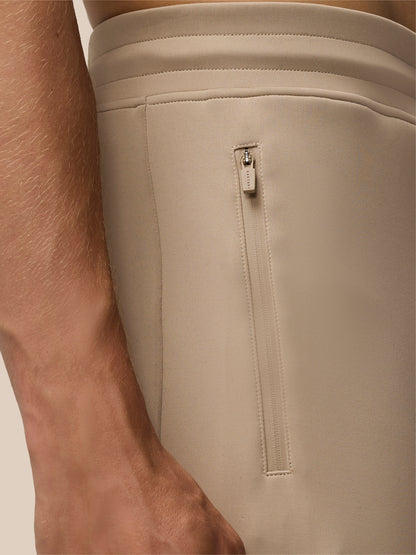 Mushroom Flex Lifestyle Joggers close up at the waistband with a vertical side zip pocket and Castore branded zipper pull.