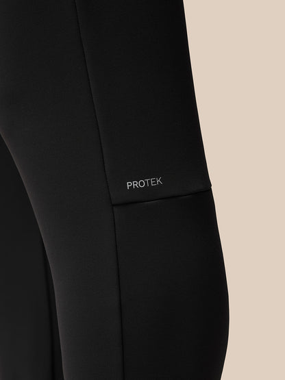Close-up view of black Flex Thermo Joggers fabric with PROTEK branding on the left thigh.