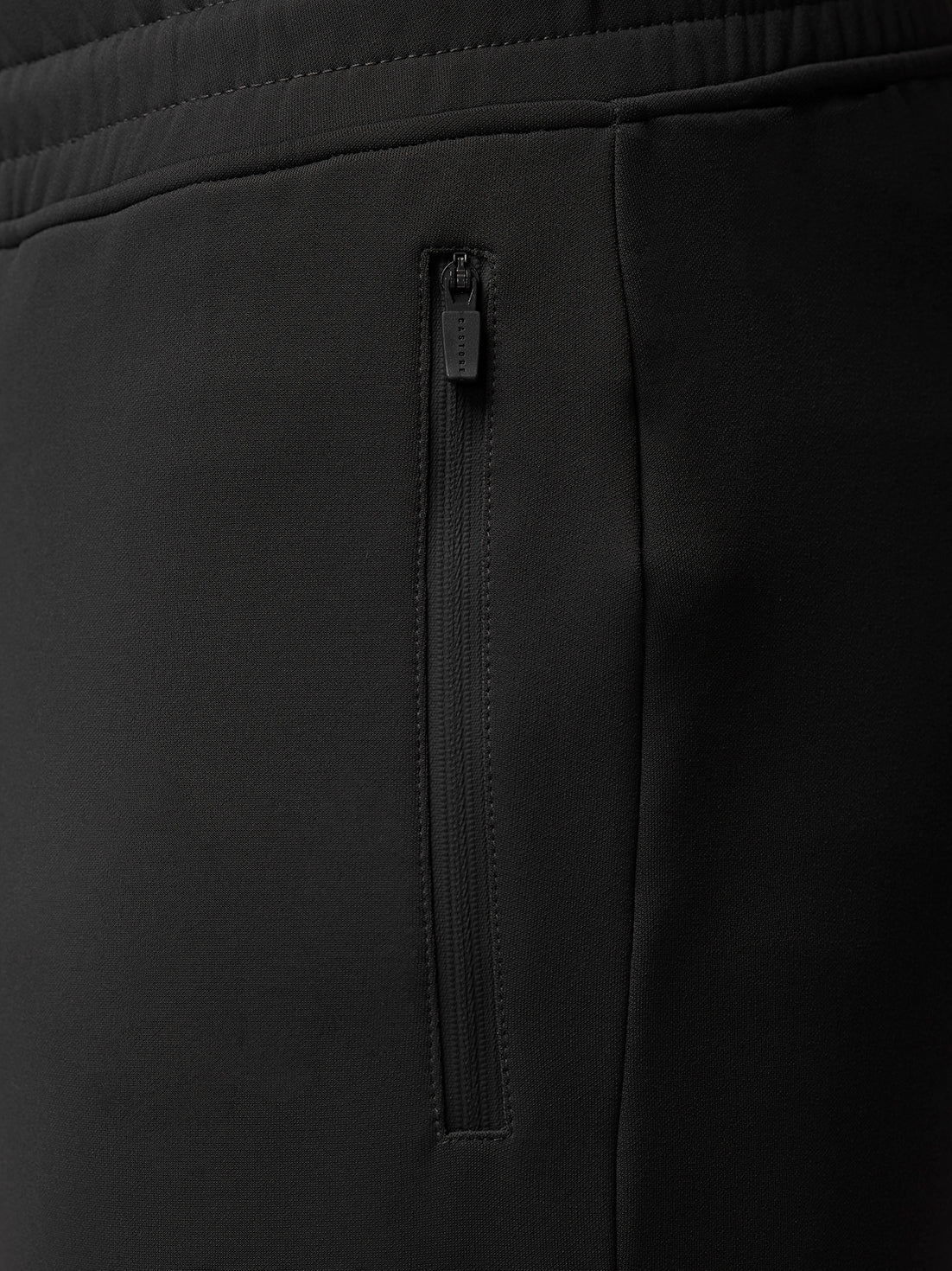 Full-body shot of male model wearing Charcoal Flex Thermo Joggers with a matching top.
