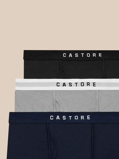 Close-up of three Castore boxer waistbands in black grey and navy with CASTORE lettering