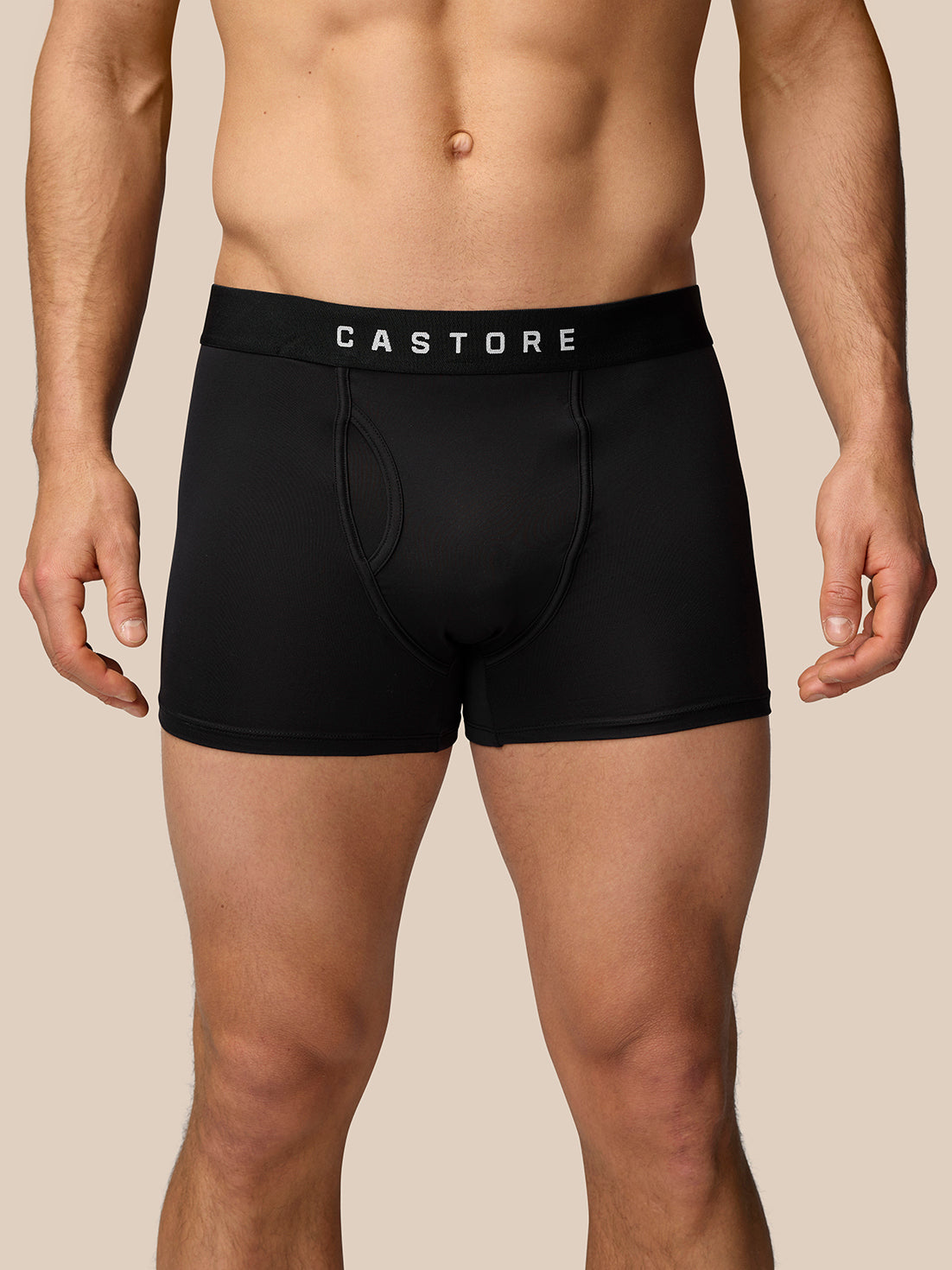 Male model wearing black boxer shorts with a wide elastic waistband branded Castore