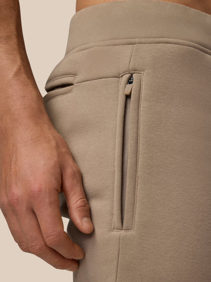 Close up of Adapt Fleece Joggers in Clay showing a vertical hip zip pocket.