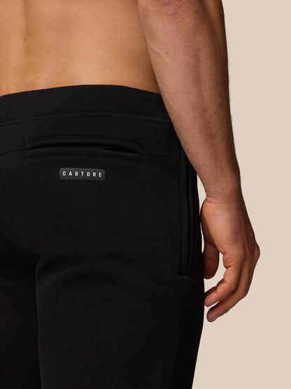 Back view of black Adapt Fleece Jogger Shorts with a rear welt pocket and Castore logo