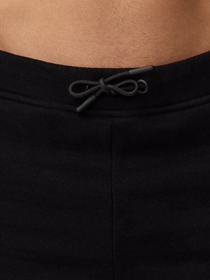 Close up of waistband with a drawcord on black Adapt Fleece Jogger Shorts