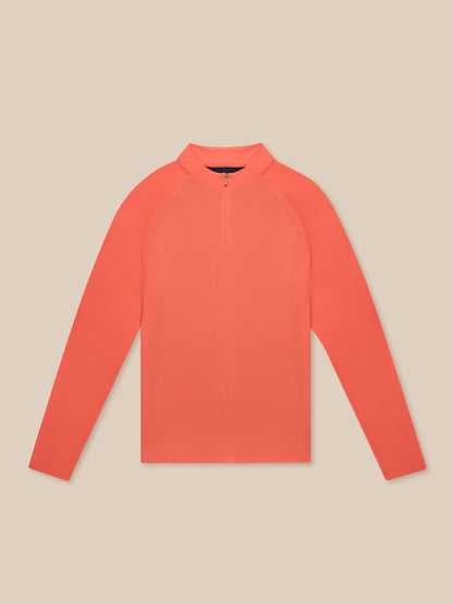 Front view of bright orange Breathable 1/4 Zip top with a stand collar laid flat.