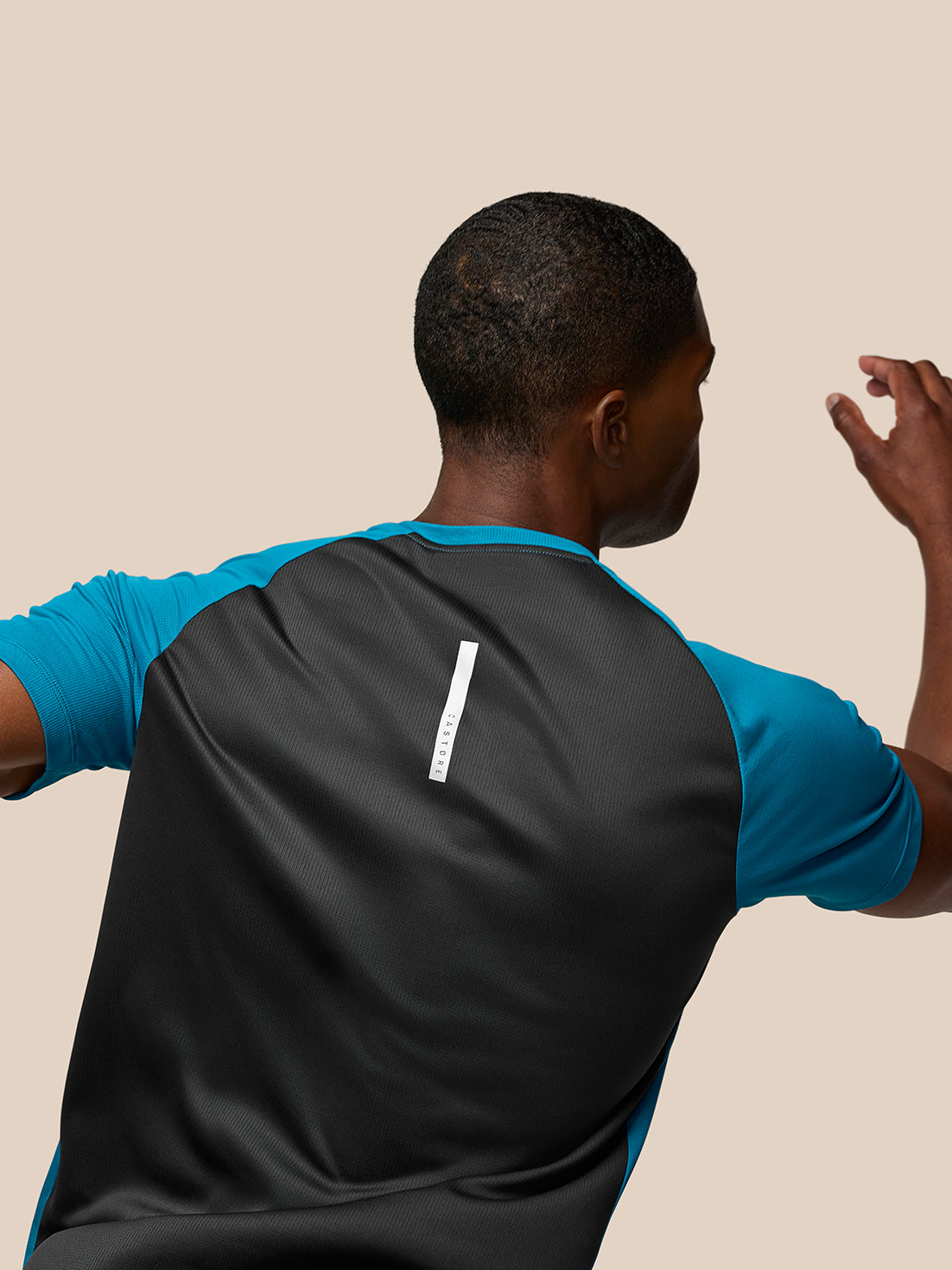 Back view of Flow Training T Shirt Dark Aqua with turquoise sleeves and a vertical white logo on the upper back