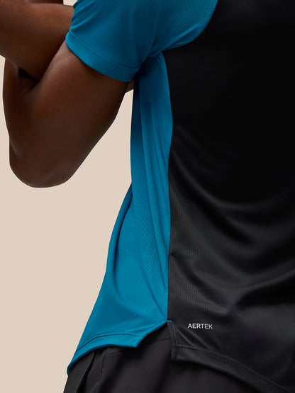 Close-up of Flow Training T Shirt Dark Aqua showing blue side panel and AerTek branding at bottom left back