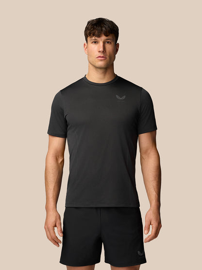 Front view of a man wearing black Apex Training T-Shirt with crew neck and reflective branding on chest