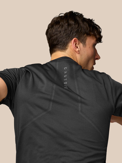 Back view of a male model in a black Apex Training T-Shirt with vertical Castore branding along the upper back.