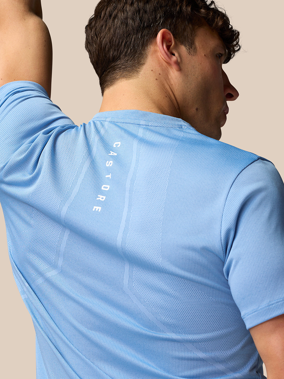 Back view of sky blue Apex Training T-Shirt with vertical Castore branding along the spine.