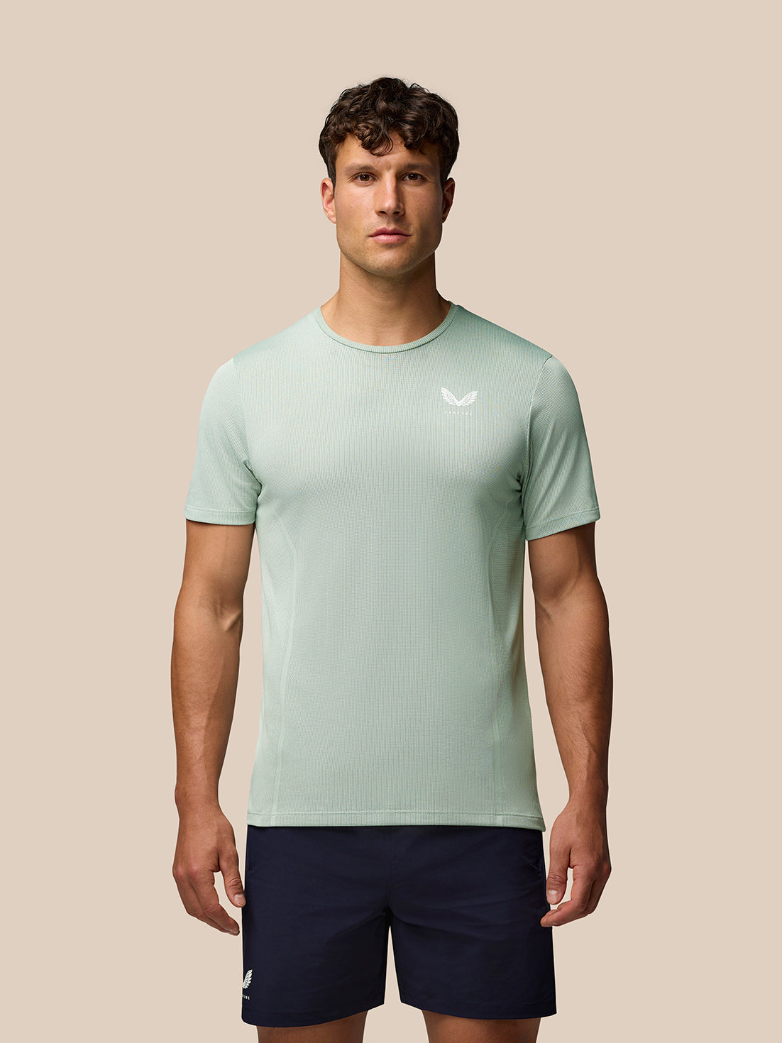 Man wearing green Apex Training T Shirt with crew neck and short sleeves