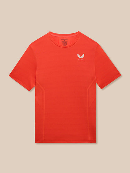 Front view of male model in red Apex Training T-Shirt with white Castore branding on the chest.