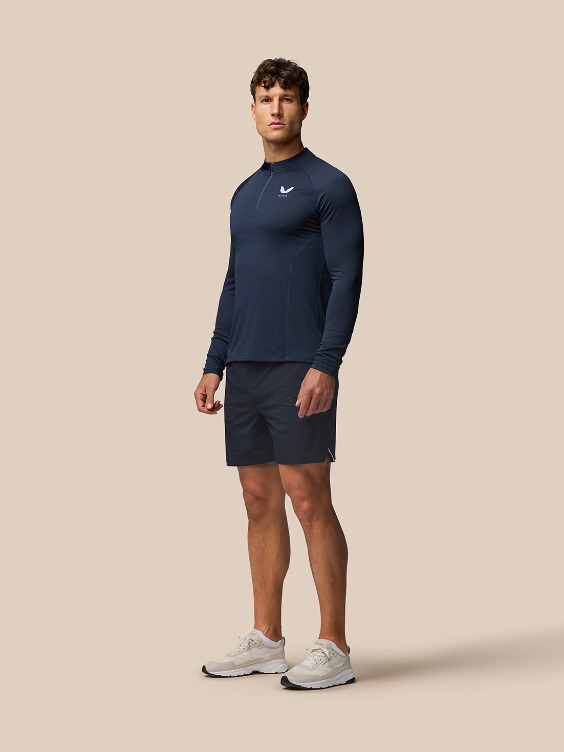 Close up of navy Apex knit fabric showing diagonal panel and Aertek branding