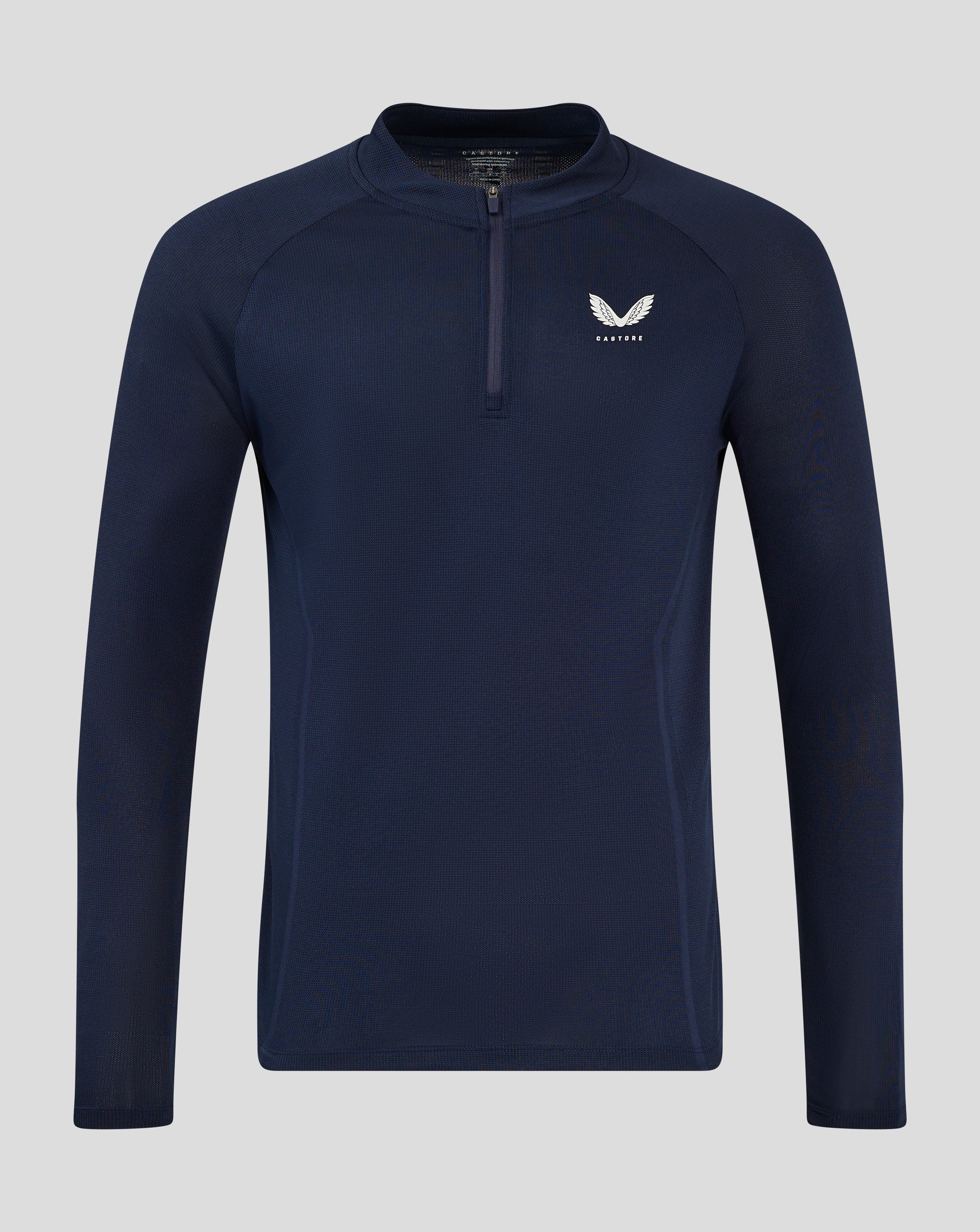 Male model wearing midnight navy Apex Training long sleeve quarter zip top with stand collar and chest logo, paired with navy shorts
