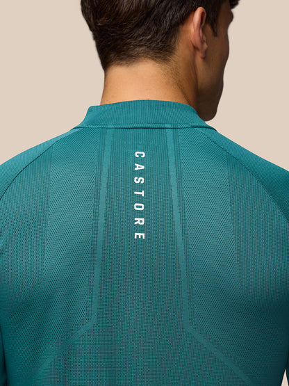 Back view close up of teal training top showing vertical AERTEK branding on the back