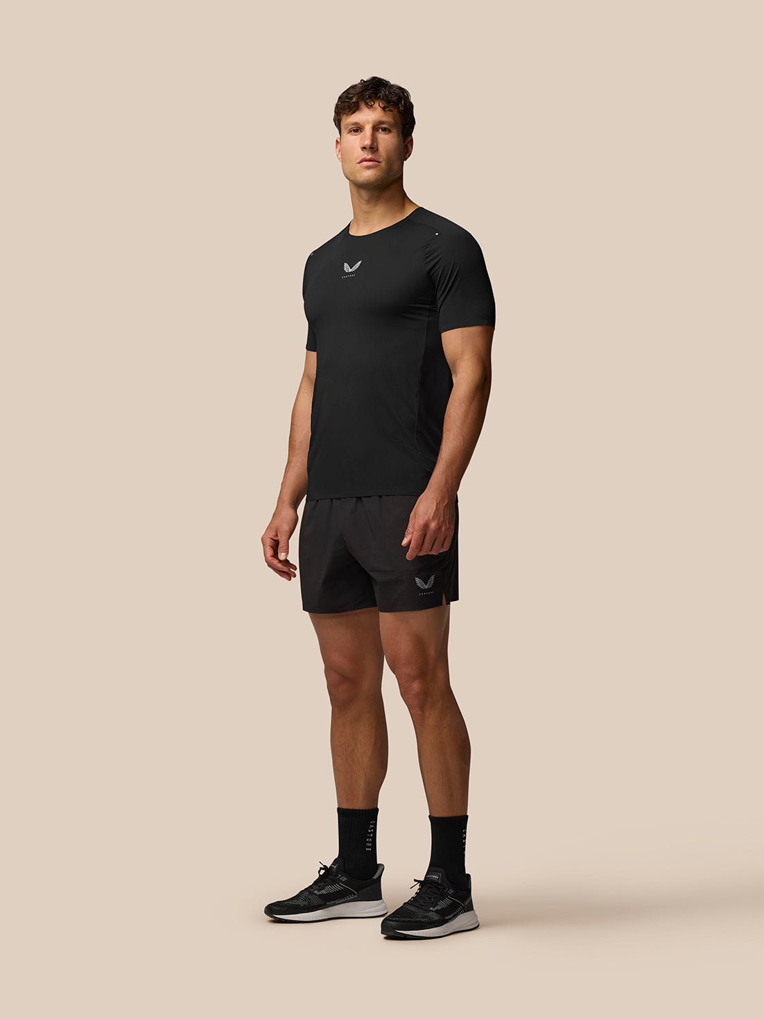 Full-body shot of a man wearing Zone Training T-Shirt with matching shorts.