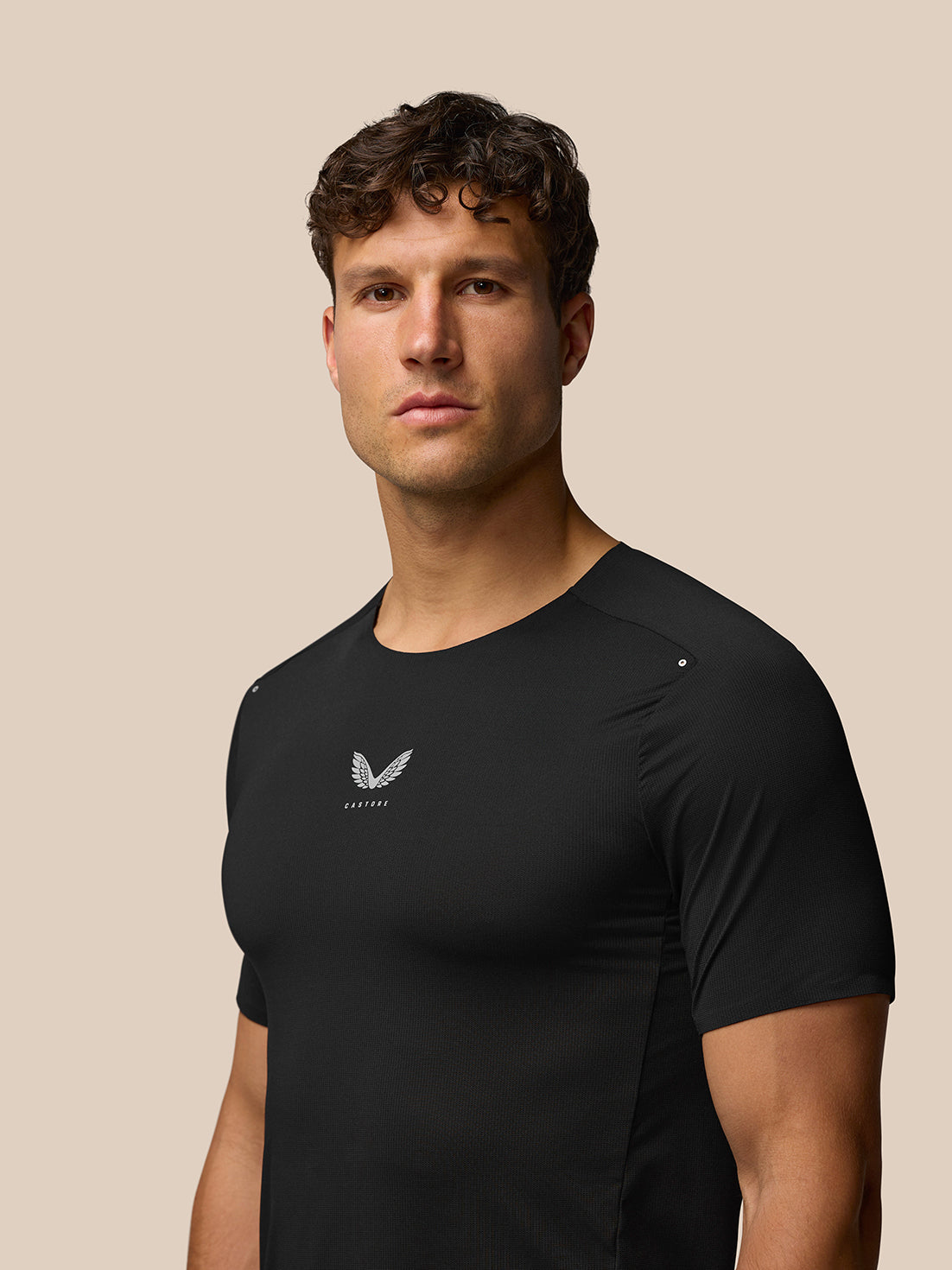 Back view of Zone Training T-Shirt in black on a male model showing a sleek fitted silhouette