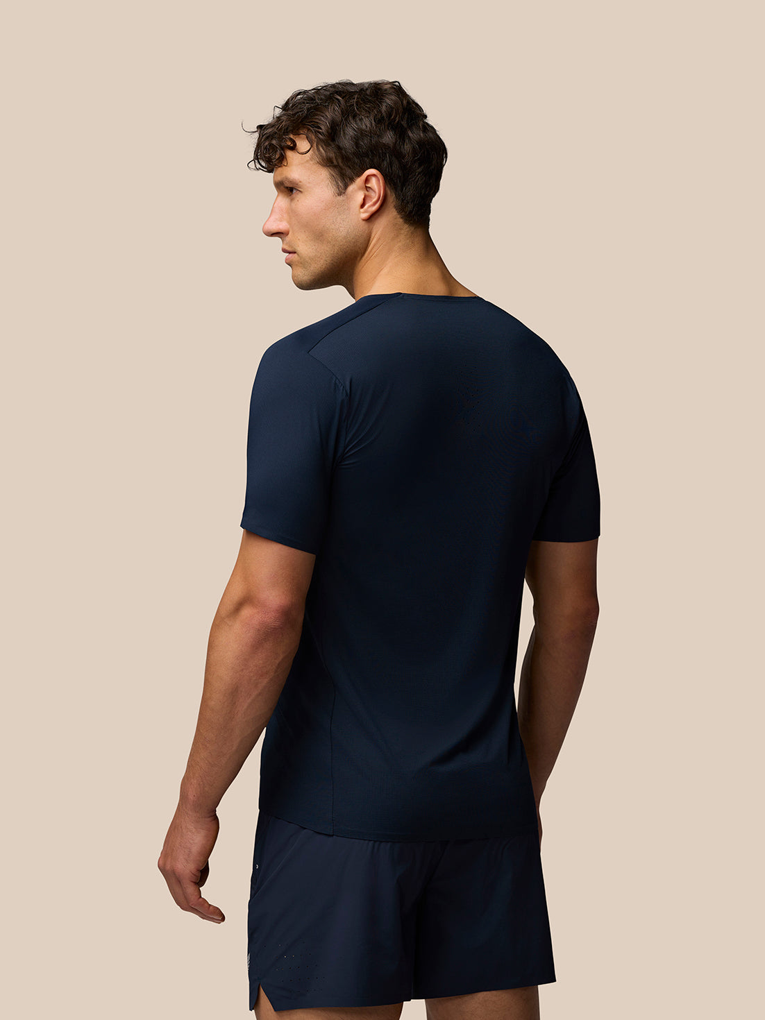 Back view of navy Zone Training T Shirt on a male model highlighting short sleeves and streamlined finish