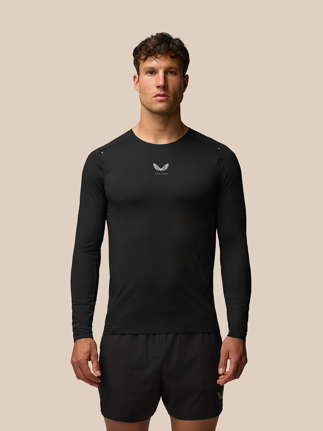 Front view of male model wearing black Zone Training T Shirt long sleeve