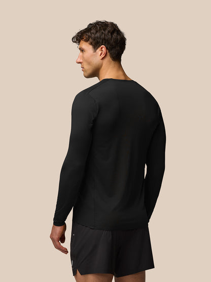 Back view of male model wearing black Zone Training T Shirt long sleeve