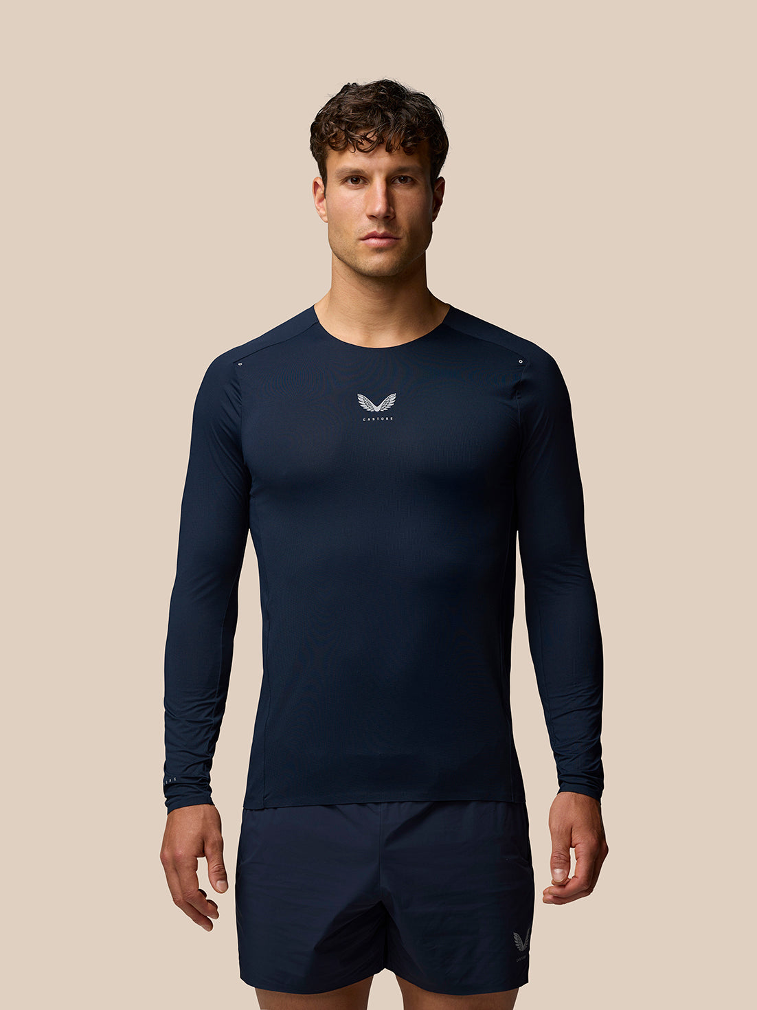 Model wearing navy Zone Training T Shirt long sleeve with crew neck and ventilation details
