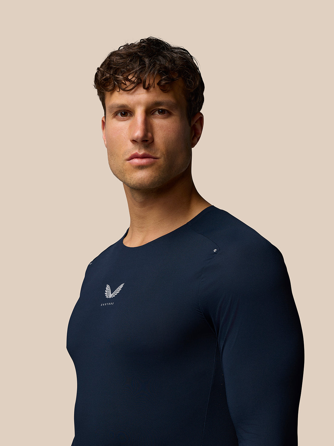 Man wearing navy Zone Training T Shirt long sleeve with subtle chest branding