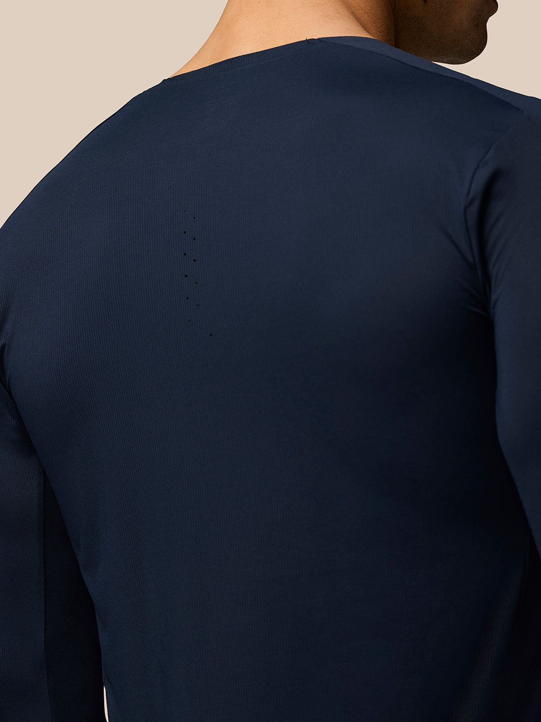 Back view of navy Zone Training T Shirt showing halo eyelets and laser cut ventilation
